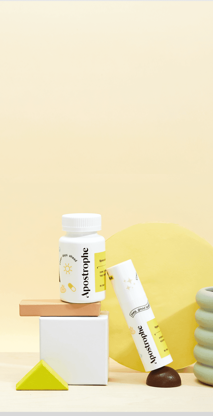 Apostrophe Oral medication and topical medication bottles stacked on shapes